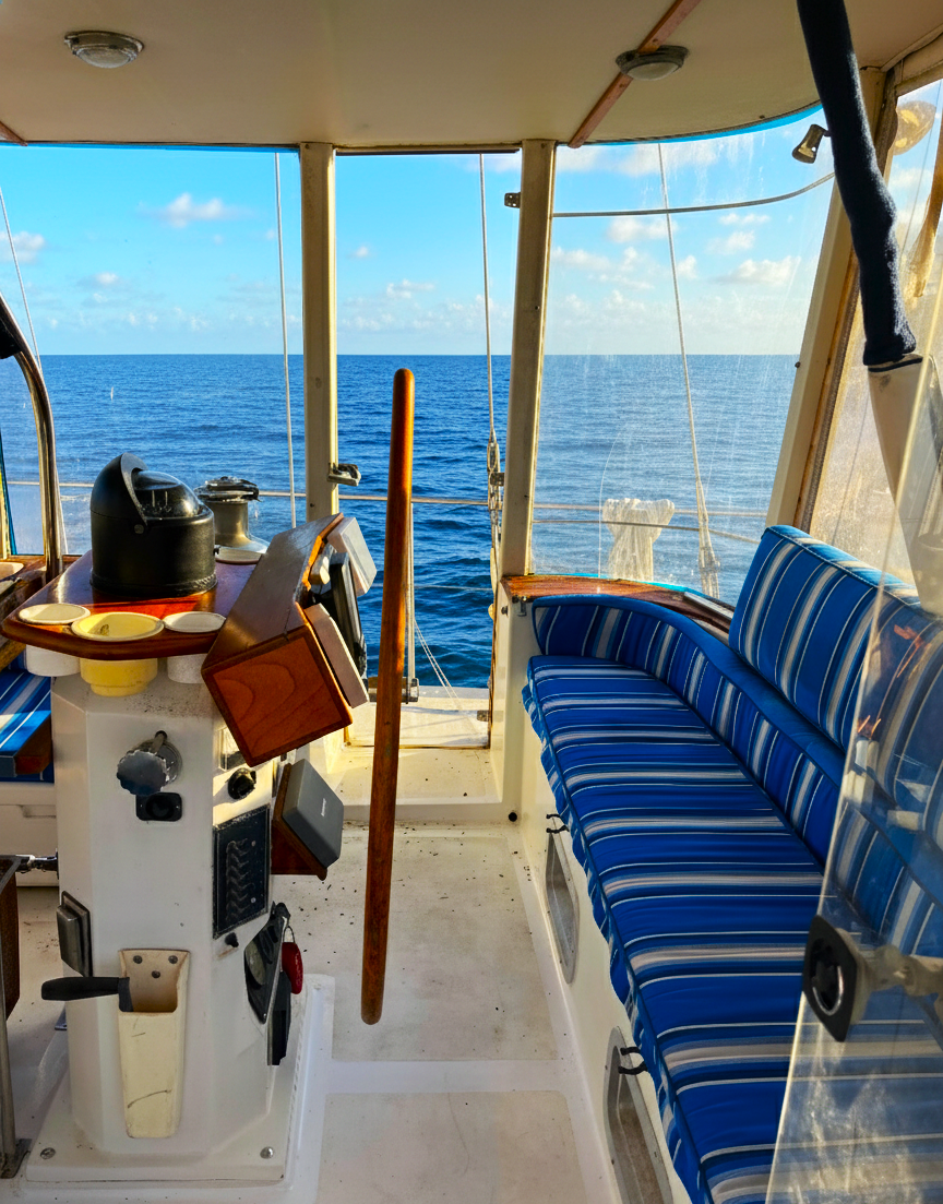 Irwin 45 under sail on calm water